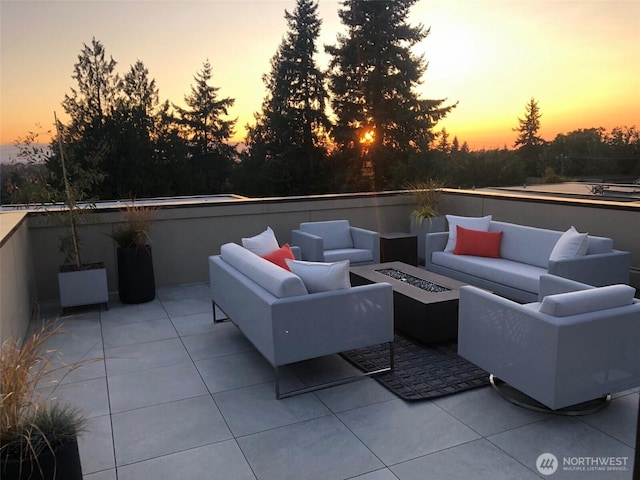 view of patio / terrace featuring an outdoor living space with a fire pit