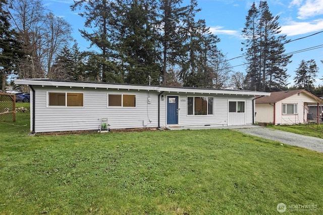 ranch-style home with a front yard and driveway