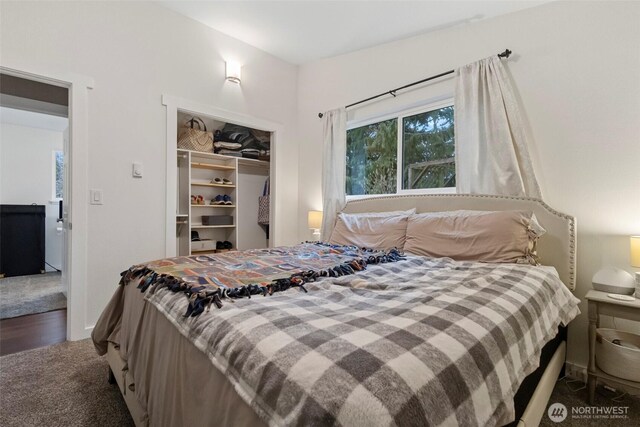 carpeted bedroom with a closet