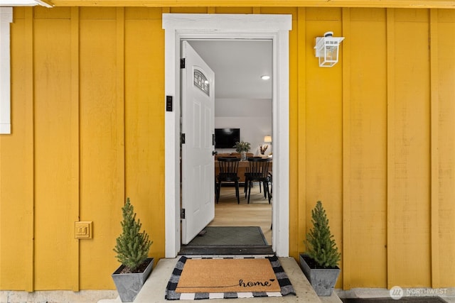 doorway to property with board and batten siding