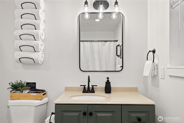 bathroom with vanity and toilet