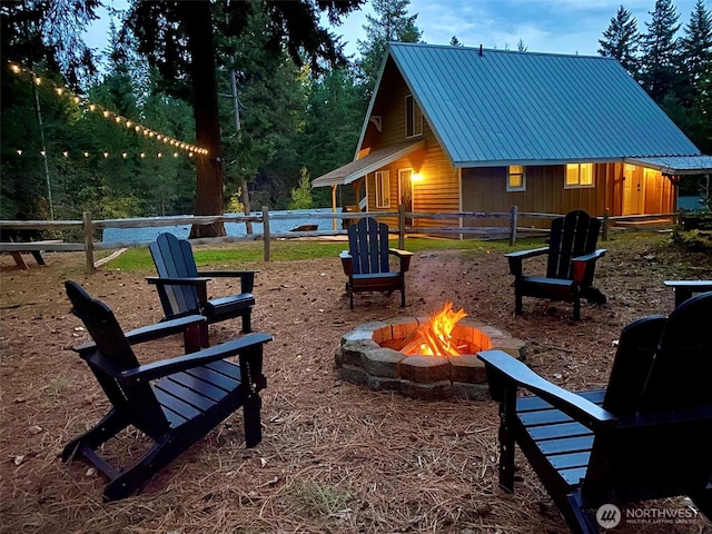 exterior space with a fire pit