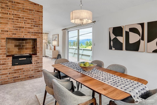 dining room featuring carpet and a chandelier