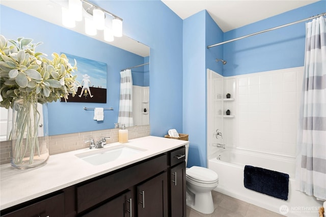 full bathroom featuring vanity, shower / bath combo, decorative backsplash, tile patterned floors, and toilet