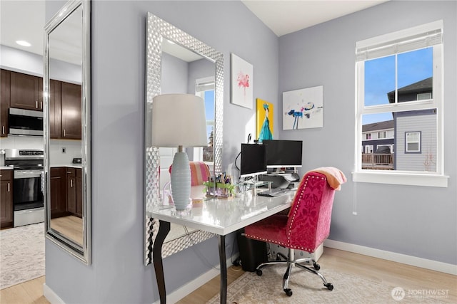 office featuring light wood finished floors and baseboards