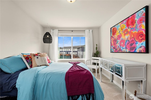 bedroom featuring baseboards and carpet floors