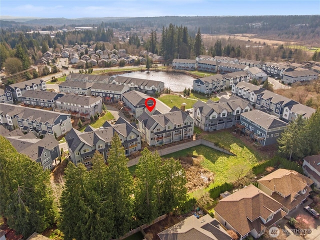 bird's eye view with a residential view and a water view