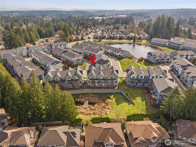 bird's eye view featuring a residential view and a water view