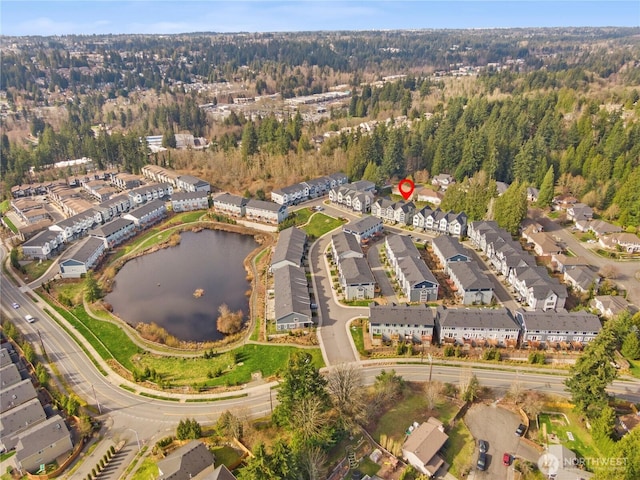 drone / aerial view featuring a residential view and a water view