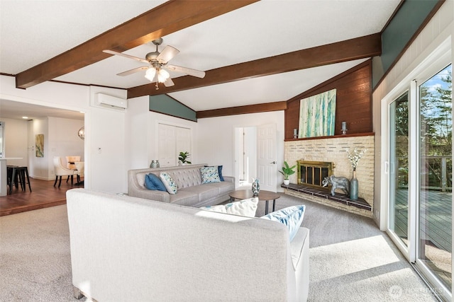 living area featuring a fireplace, lofted ceiling with beams, an AC wall unit, carpet flooring, and ceiling fan