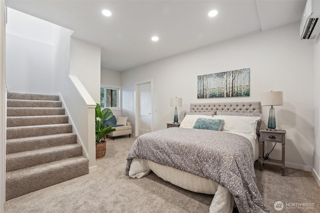 carpeted bedroom with recessed lighting, baseboards, and a wall mounted AC