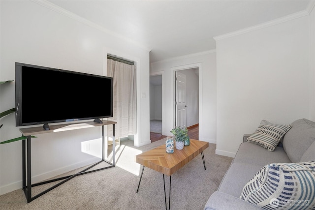 carpeted living room featuring baseboards and ornamental molding