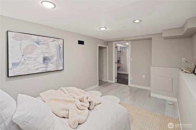 bedroom with recessed lighting, connected bathroom, visible vents, and baseboards