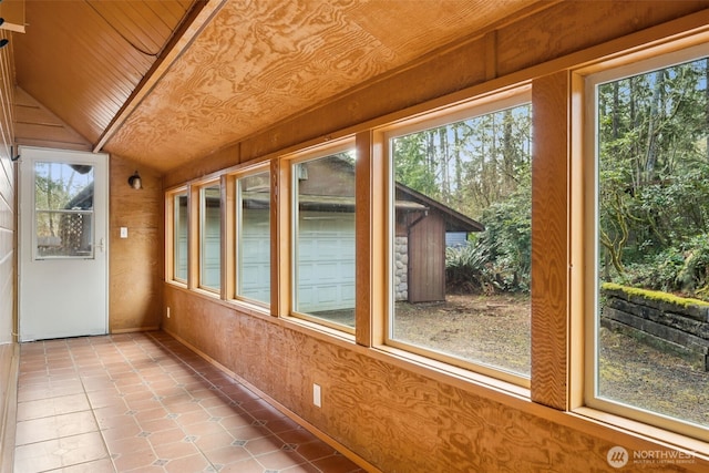 unfurnished sunroom featuring wooden ceiling and vaulted ceiling