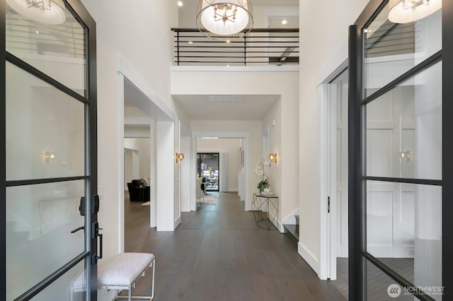 10906 SE 28th St, Bellevue, WA 98004 - entrance foyer with baseboards, a high ceiling, and dark wood finished floors