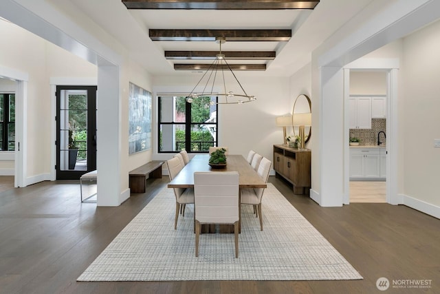10906 SE 28th St, Bellevue, WA 98004 - dining space featuring dark wood-style flooring, baseboards, and a chandelier