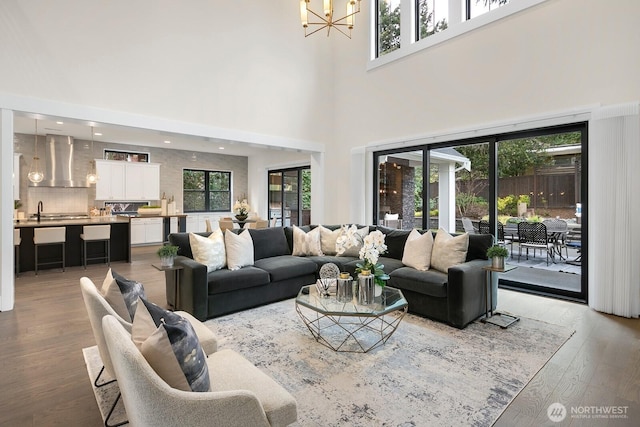 10906 SE 28th St, Bellevue, WA 98004 - living area with a notable chandelier, a healthy amount of sunlight, and light wood-type flooring