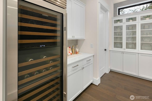 10906 SE 28th St, Bellevue, WA 98004 - bar featuring decorative backsplash, wine cooler, and dark wood finished floors