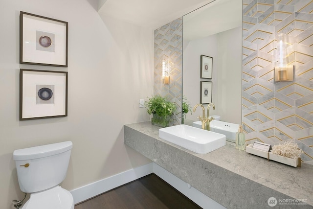 10906 SE 28th St, Bellevue, WA 98004 - half bathroom featuring baseboards, a sink, toilet, and wood finished floors