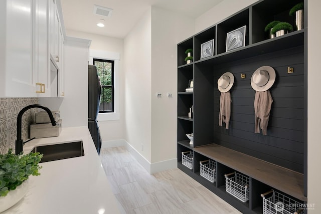 10906 SE 28th St, Bellevue, WA 98004 - mudroom with recessed lighting, a sink, baseboards, and visible vents