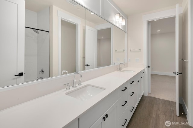 10906 SE 28th St, Bellevue, WA 98004 - full bath featuring double vanity, a sink, baseboards, and visible vents