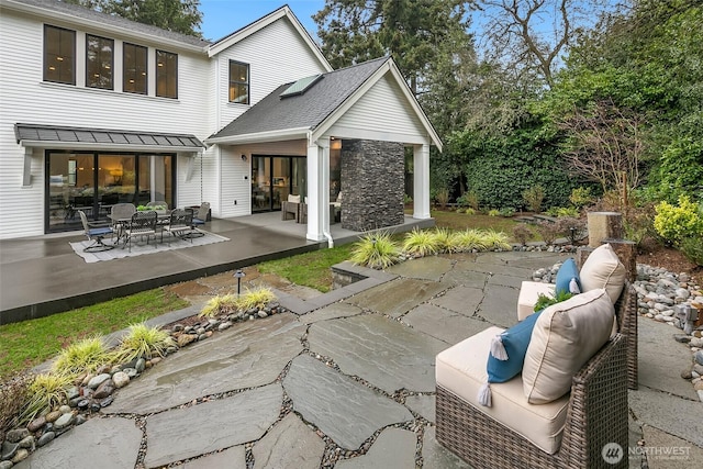 10906 SE 28th St, Bellevue, WA 98004 - back of house featuring an outdoor living space, stone siding, and a patio