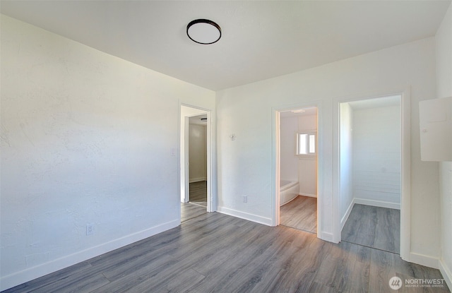 105 Redpath St, Kelso, WA 98675 - unfurnished bedroom featuring wood finished floors and baseboards