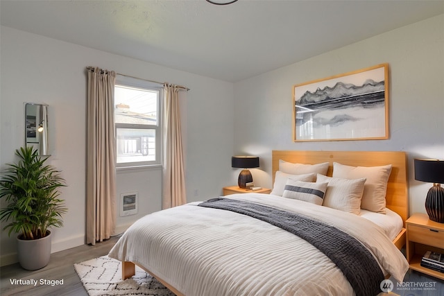 105 Redpath St, Kelso, WA 98675 - bedroom with wood finished floors, heating unit, and baseboards