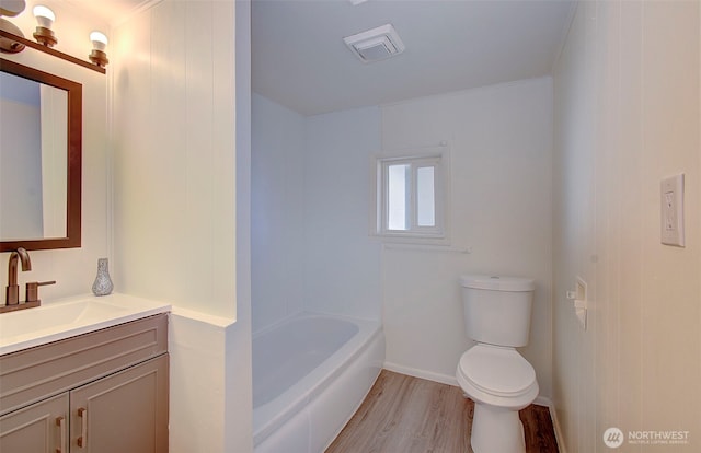 105 Redpath St, Kelso, WA 98675 - full bath featuring wood finished floors, toilet, vanity, a tub, and a shower