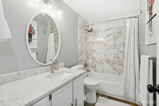 full bathroom featuring vanity, toilet, and shower / tub combo