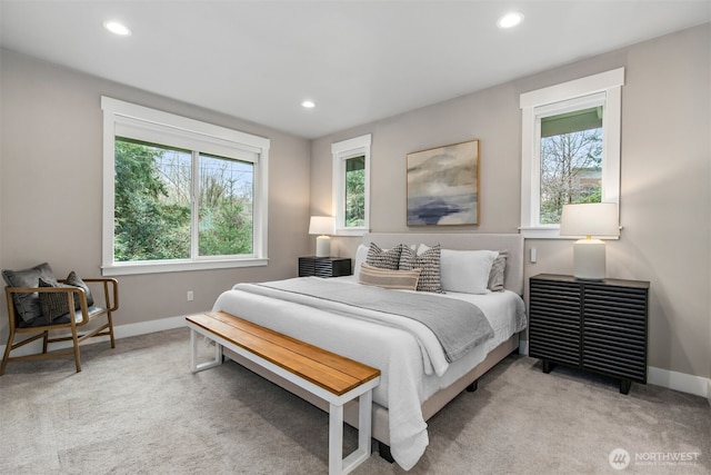 bedroom featuring recessed lighting, baseboards, and light colored carpet