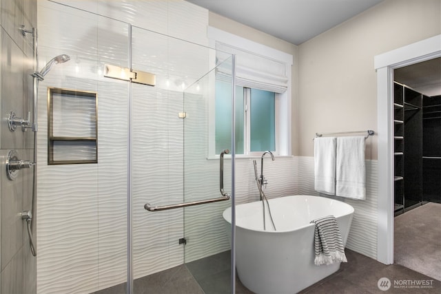 full bathroom with a soaking tub, a shower stall, and tile walls