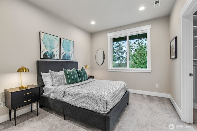 carpeted bedroom with recessed lighting, visible vents, and baseboards