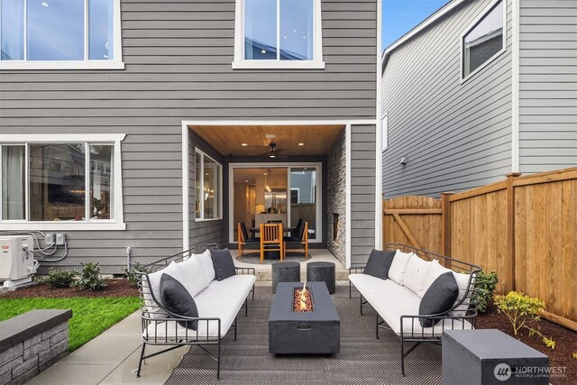 view of patio / terrace with a ceiling fan, ac unit, an outdoor living space with a fire pit, and fence