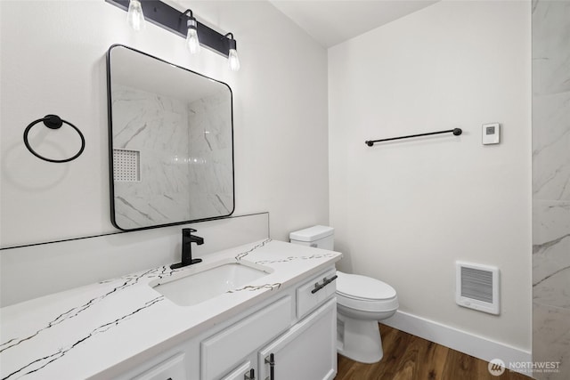 full bath featuring visible vents, toilet, wood finished floors, baseboards, and vanity