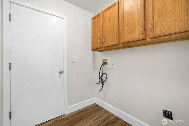 clothes washing area with baseboards, hookup for a washing machine, wood finished floors, cabinet space, and hookup for an electric dryer