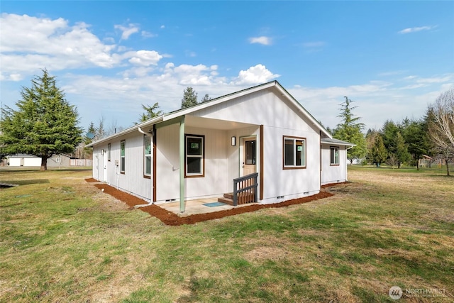 exterior space with a lawn and crawl space