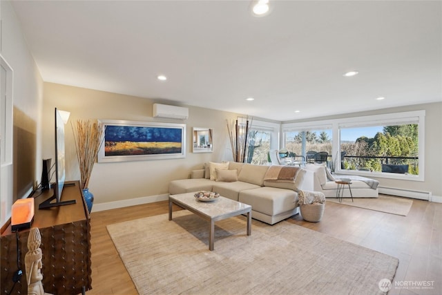 living area featuring a wall unit AC, wood finished floors, a wealth of natural light, and recessed lighting