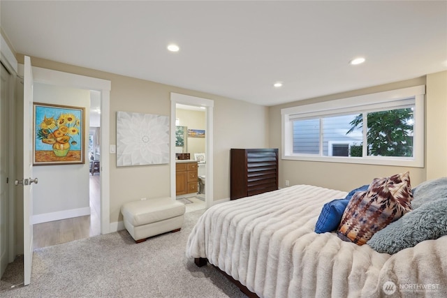 bedroom featuring carpet, baseboards, ensuite bathroom, and recessed lighting