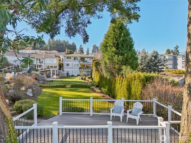 exterior space featuring a residential view and a yard