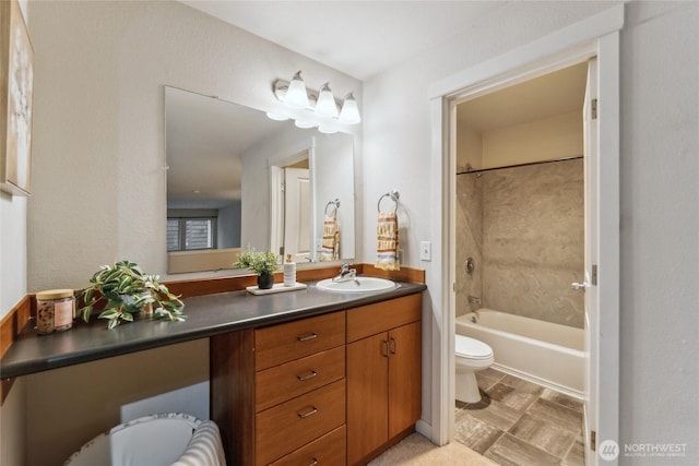 full bathroom with vanity, shower / tub combination, and toilet