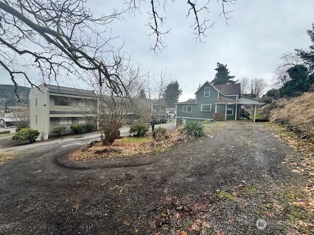 view of property exterior with driveway