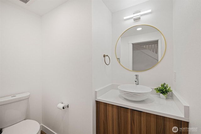 bathroom with vanity and toilet