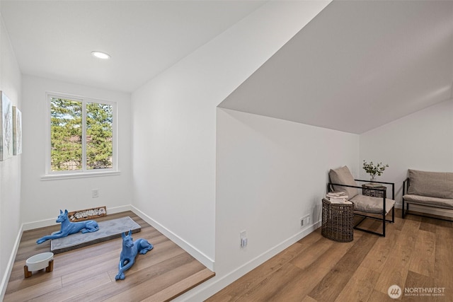 workout area featuring recessed lighting, wood finished floors, and baseboards