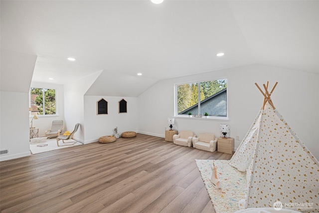 bonus room with baseboards, visible vents, wood finished floors, vaulted ceiling, and recessed lighting