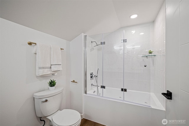 bathroom with combined bath / shower with glass door and toilet