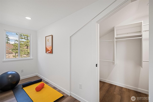 exercise area with recessed lighting, baseboards, and wood finished floors