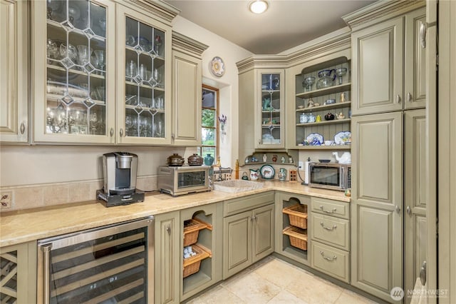 1939 49th St, Port Townsend, WA 98368 - bar with wine cooler, stainless steel microwave, and light tile patterned floors