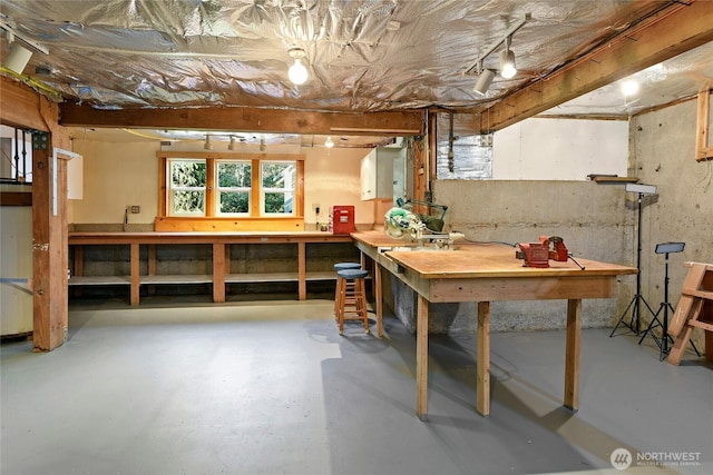 basement with a workshop area