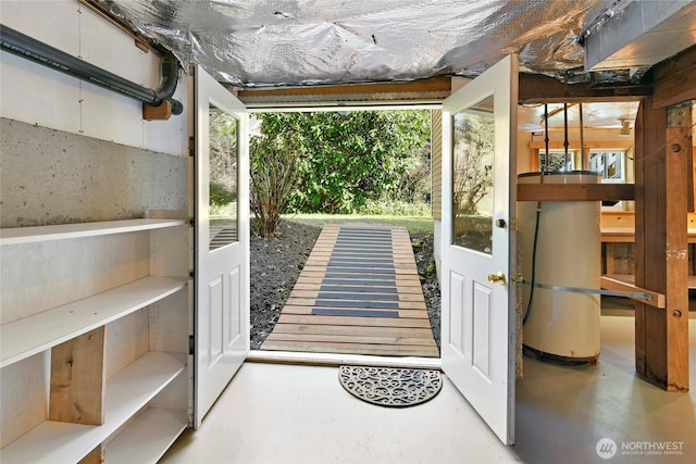 doorway to outside featuring finished concrete flooring